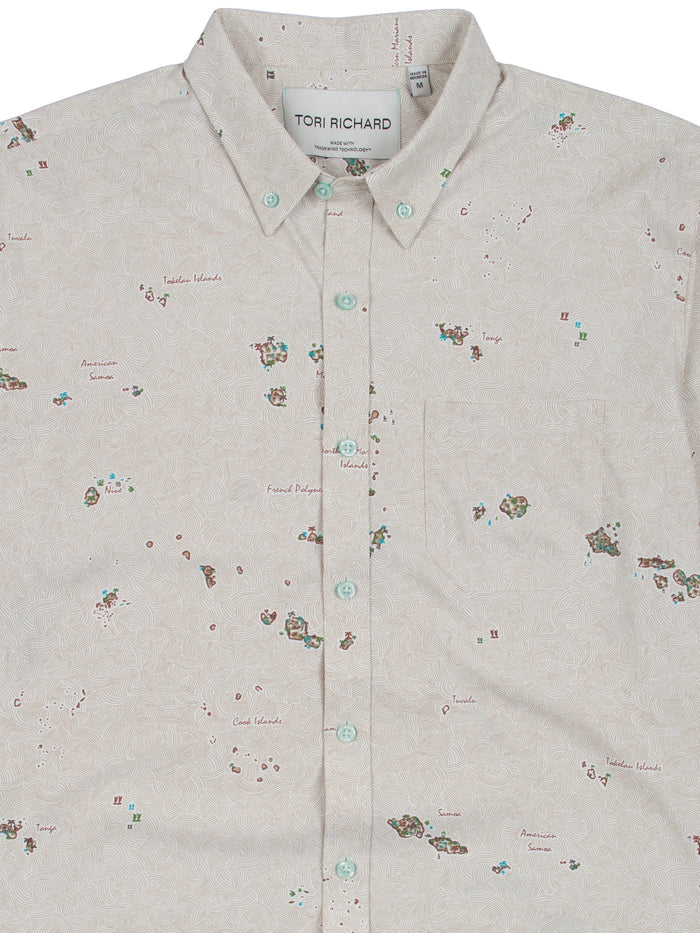 Beige map-print short-sleeve shirt with mint buttons, front view.