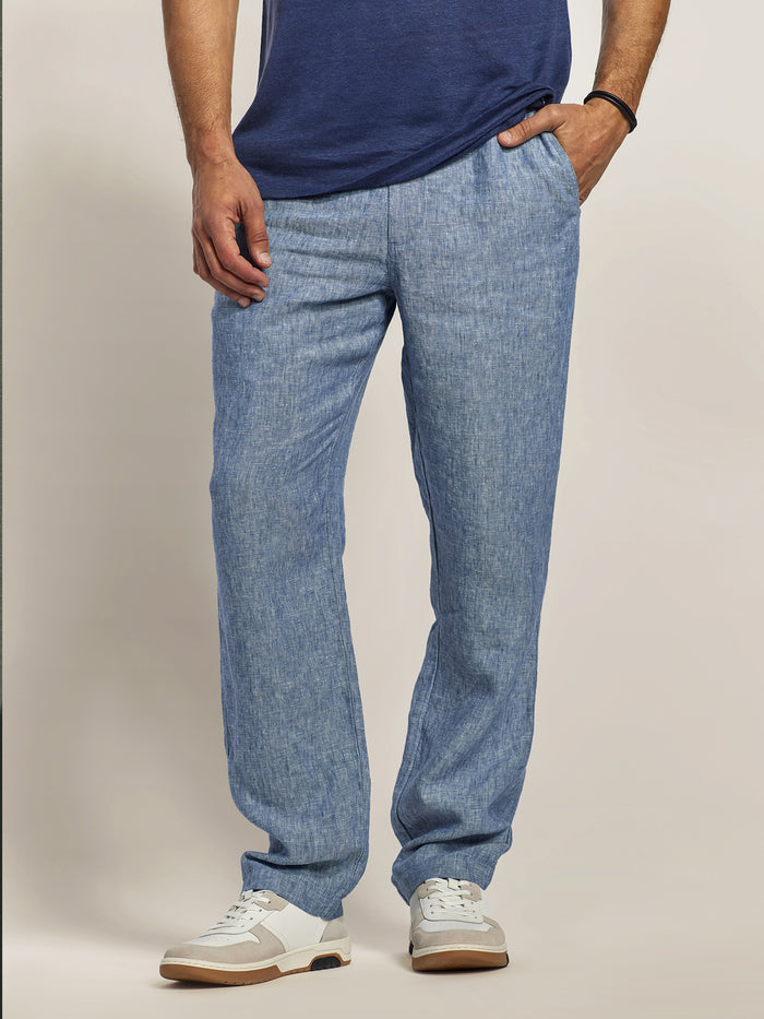 Chambray linen pant, navy t-shirt and white shoes, front view.