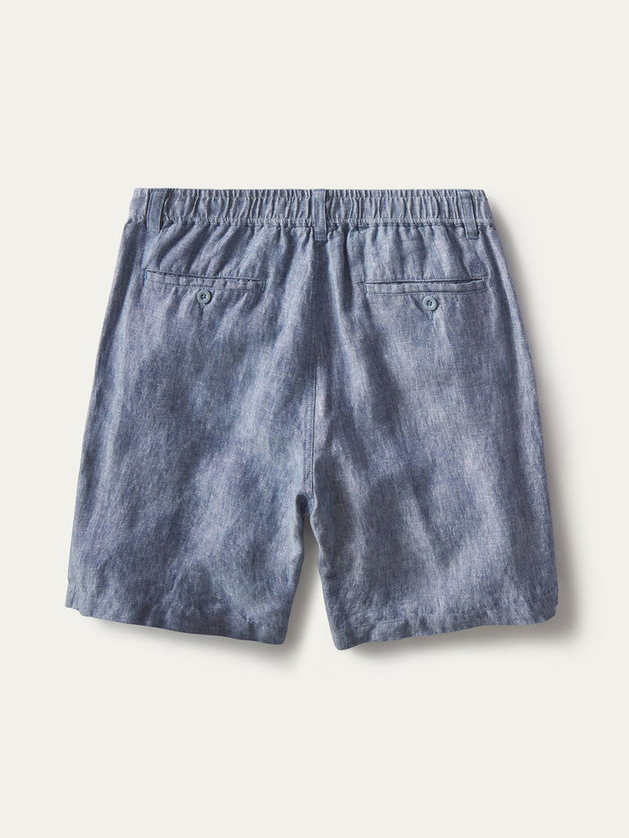 Blue linen shorts, back view with elastic waistband and two buttoned pockets (shown in two images).