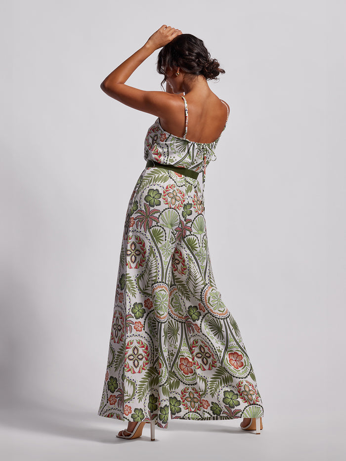 Multicolor floral sleeveless jumpsuit with wide legs and statement belt, back view.
