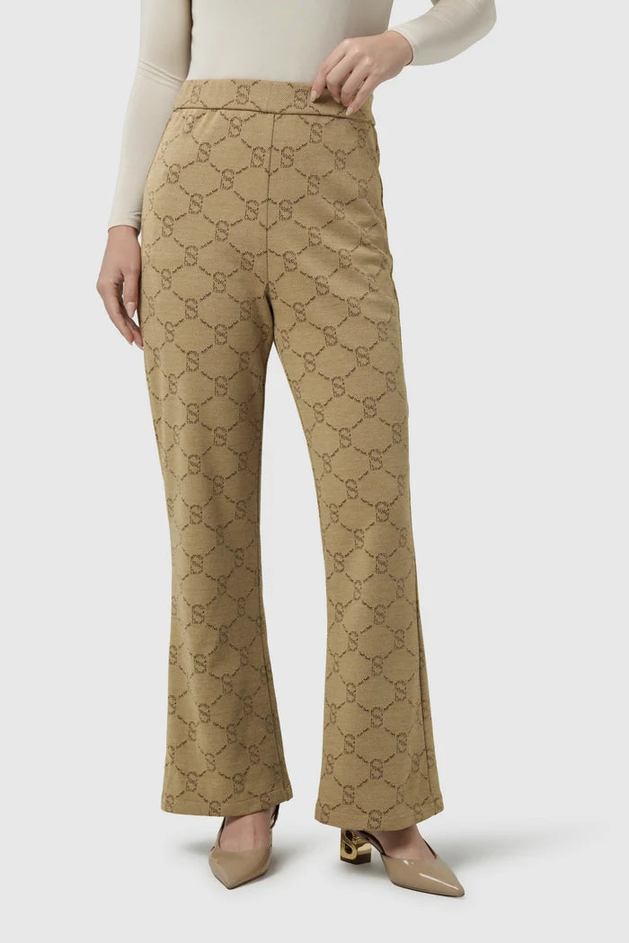 beverly monogram bootcut pants in brown by buttonscarves front view
