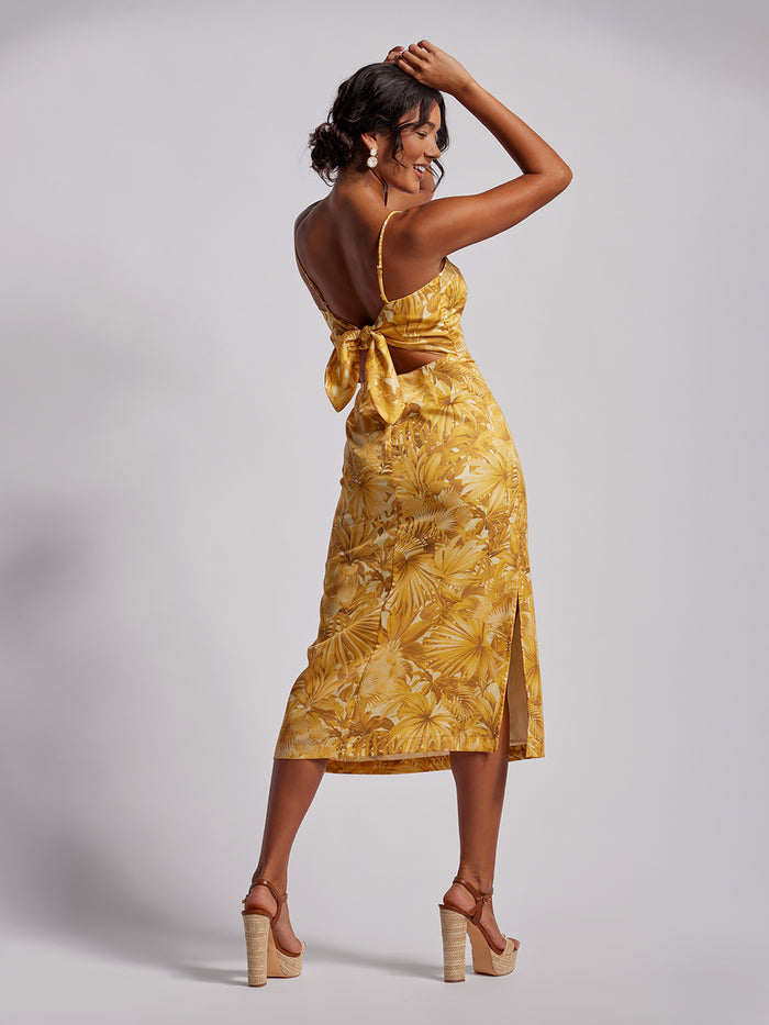Yellow floral Tencel dress, open back with bow detail, side view.