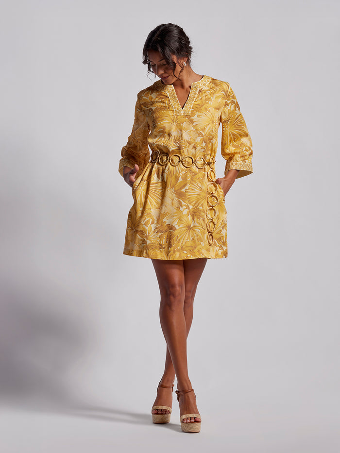 Yelllow and gold floral print midi dress with elbow sleeves, front view.