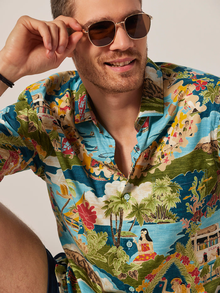 Multicolor Hawaiian tropical-print short-sleeve shirt, front view on man with sunglasses.