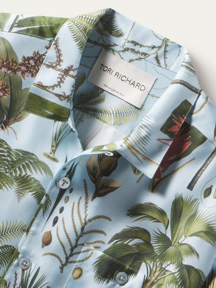 Sky Blue palm-print twill short-sleeve shirt, shown in a close-up view of the front neckline.