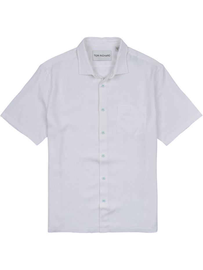 White solid silk-Tencel short-sleeve button-up shirt with chest pocket, flat lay view.