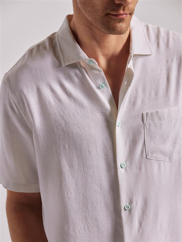 White Book of Water print short-sleeve shirt with chest pocket, shoulder to mid-torso view.
