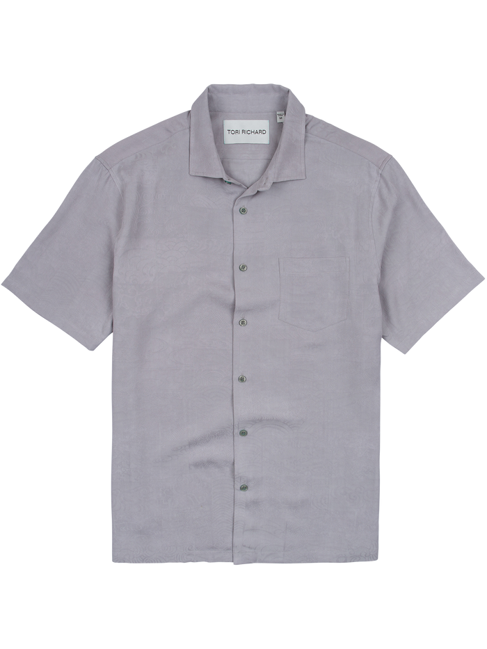 Grey short-sleeve shirt with Japanese wave pattern, flat lay on white.