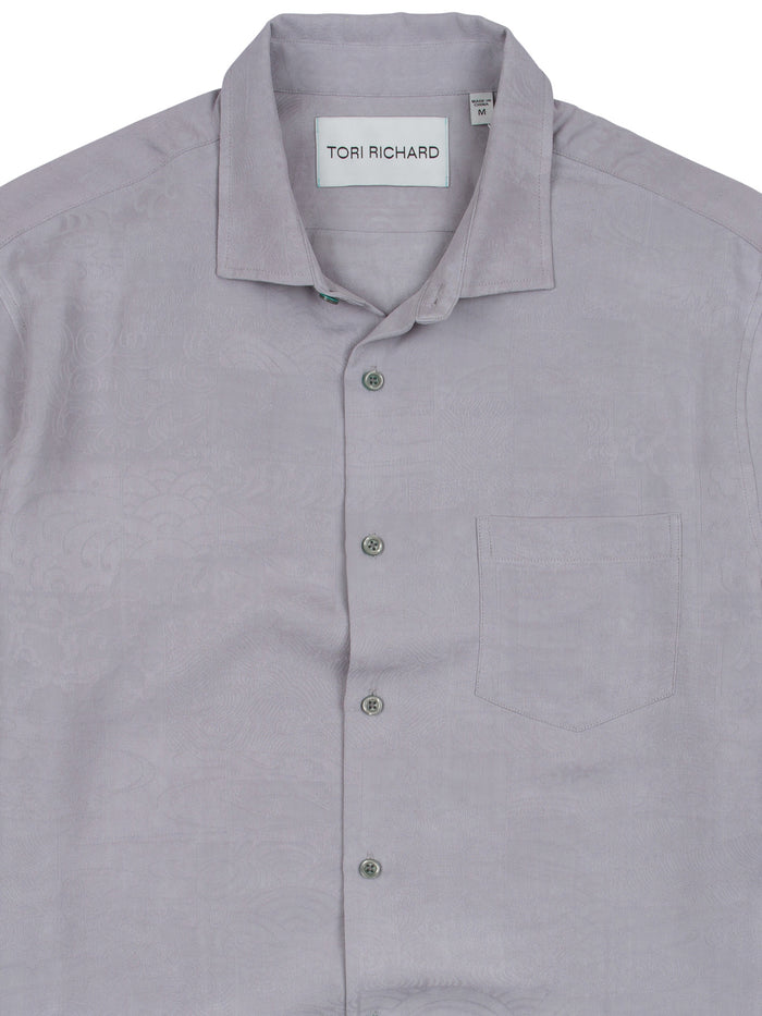Grey jacquard short-sleeve shirt, chest pocket, label inside collar, front view.