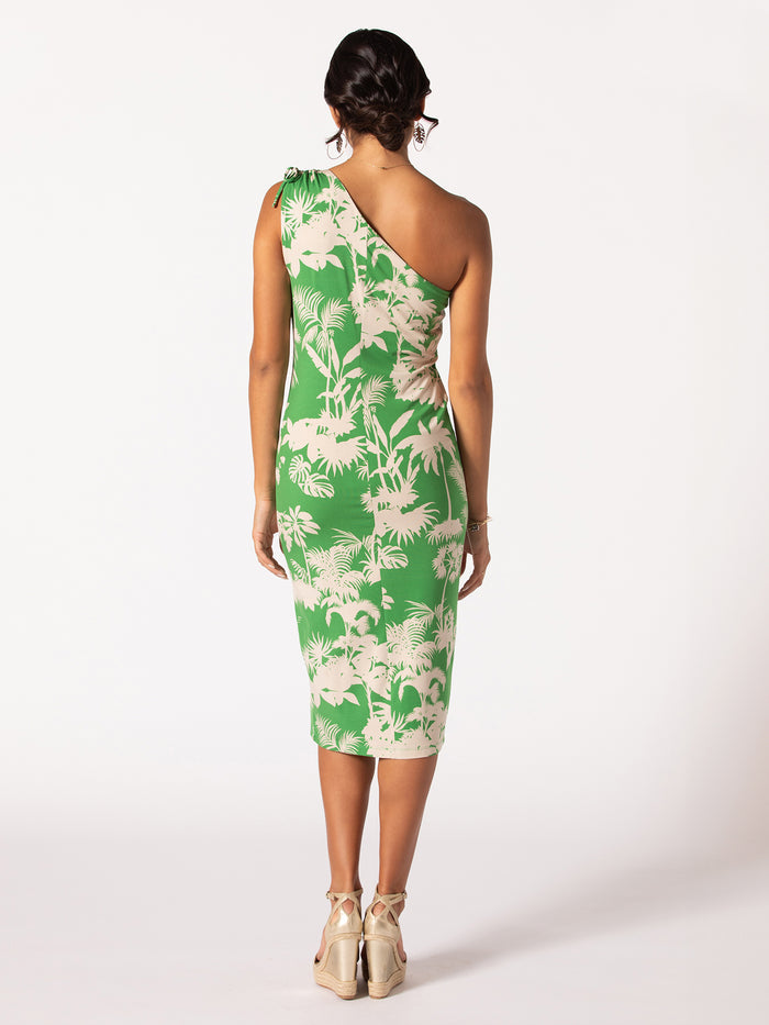 Green floral Keilani dress, back view of woman standing on white background.