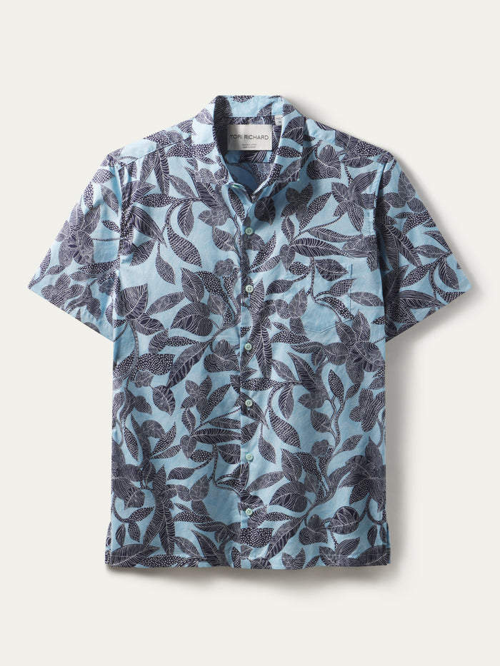 Sky blue cotton lawn shirt with dark blue tropical leaf print, shown in flat lay front view.