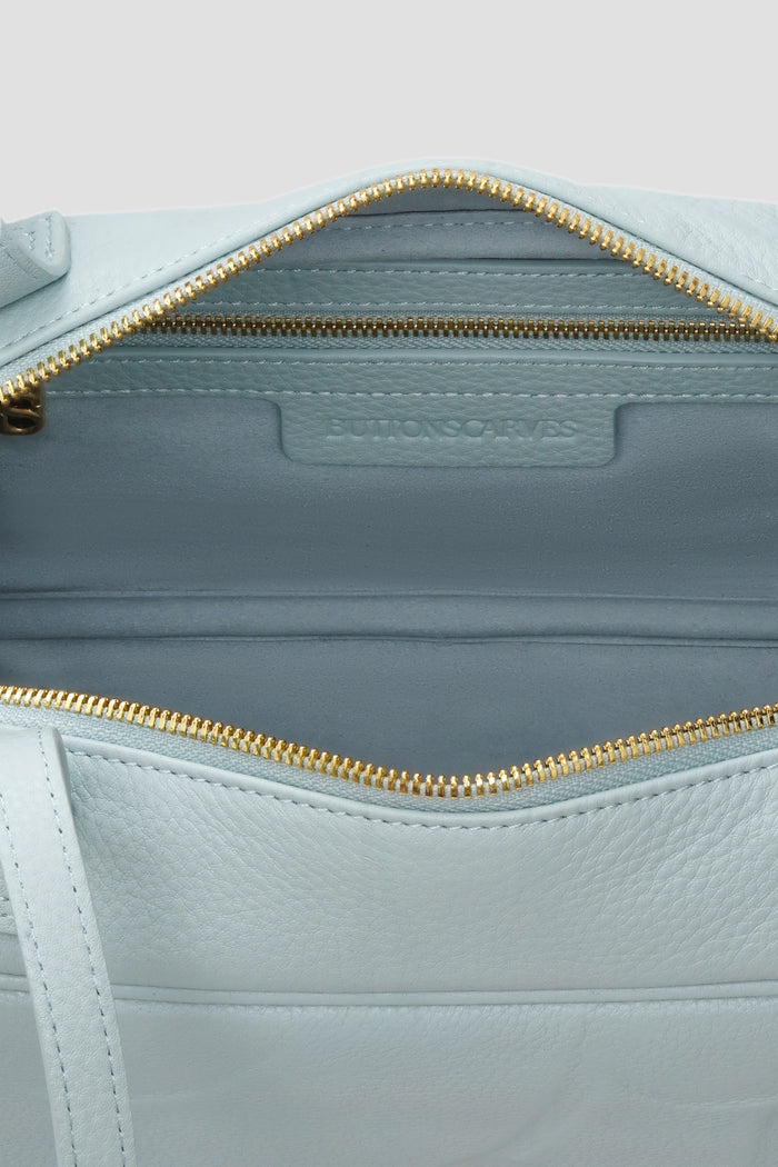 bria shoulder bag in baby blue by buttonscarves interior