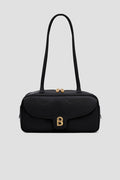 bria shoulder bag in black by buttonscarves front view
