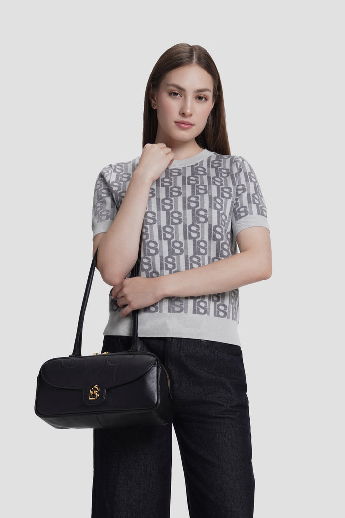 bria shoulder bag in black by buttonscarves carried on wrist
