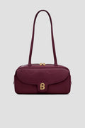 bria shoulder bag in burgundy by buttonscarves front view