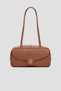 bria shoulder bag in caramel by buttonscarves front view