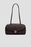 bria shoulder bag in dark brown by buttonscarves front view