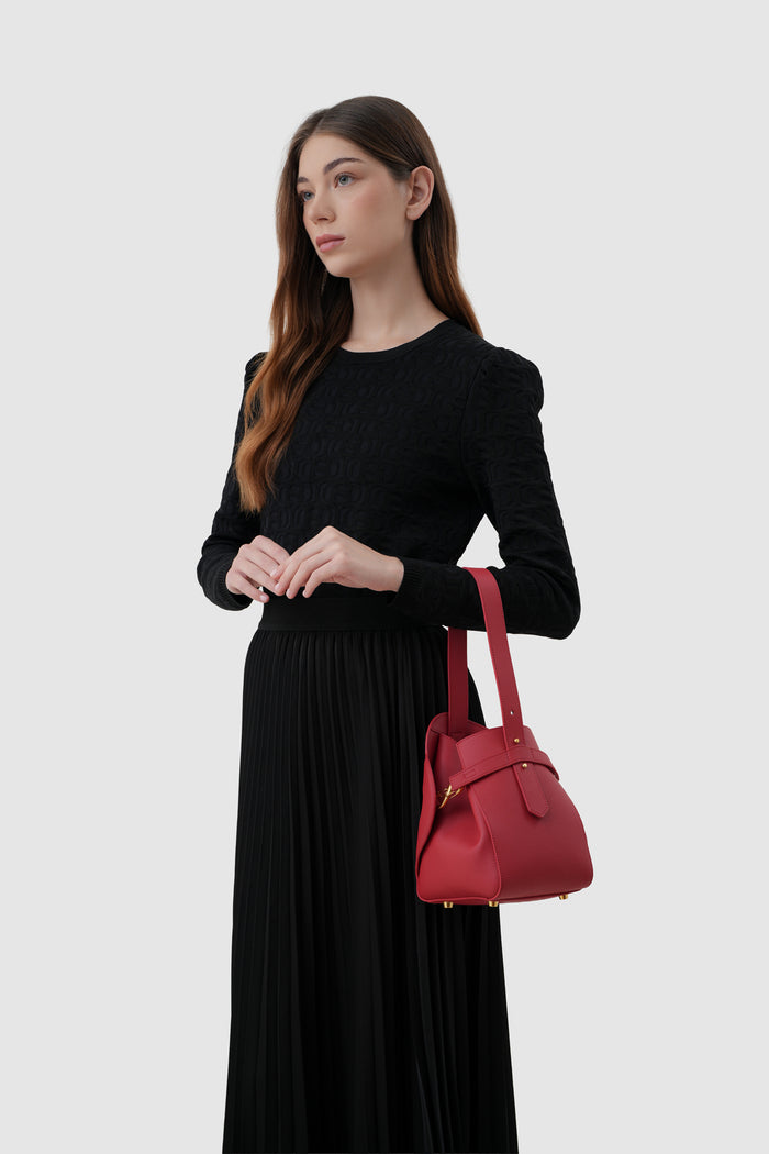 britney bag small with saffiano leather in lacca by buttonscarves carried on wrist