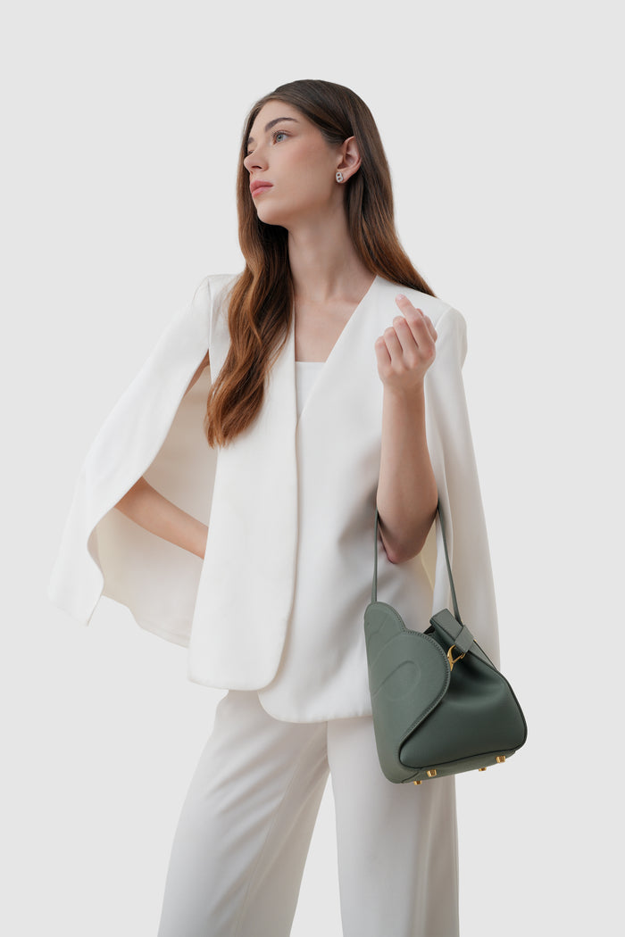 britney bag small with saffiano leather in loden by buttonscarves carried on wrist