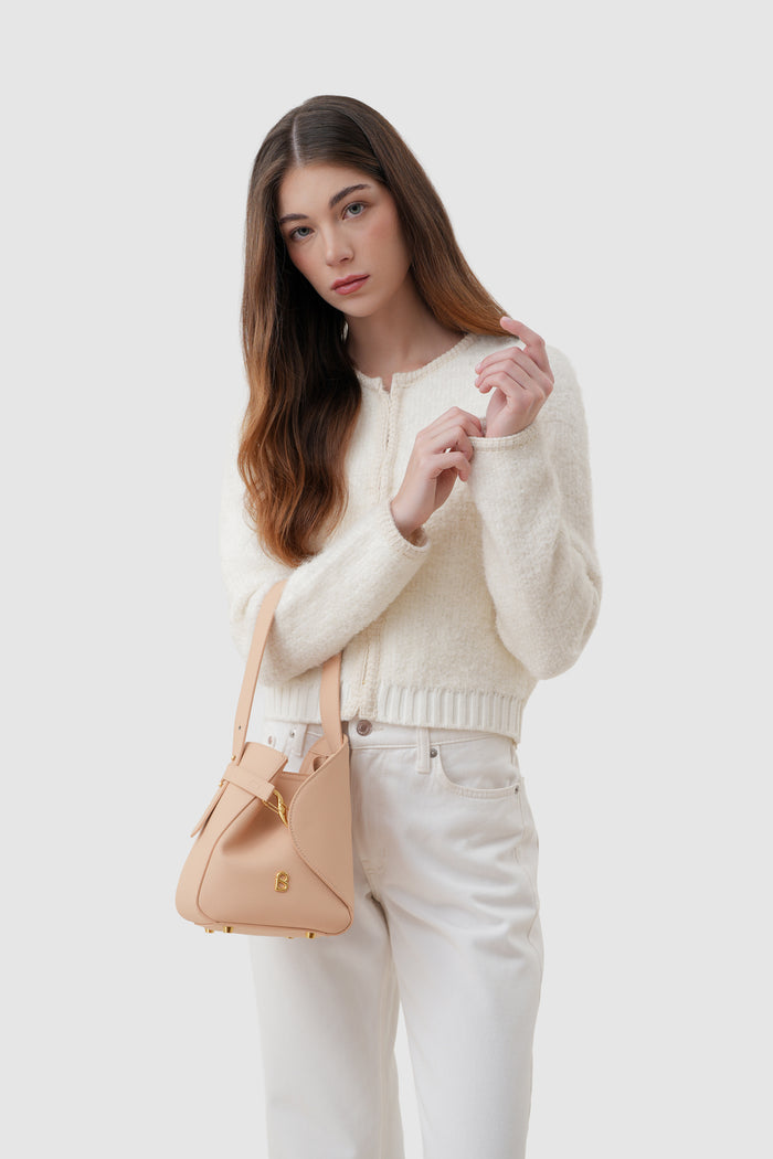 britney bag small with saffiano leather in seaside by buttonscarves carried on wrist