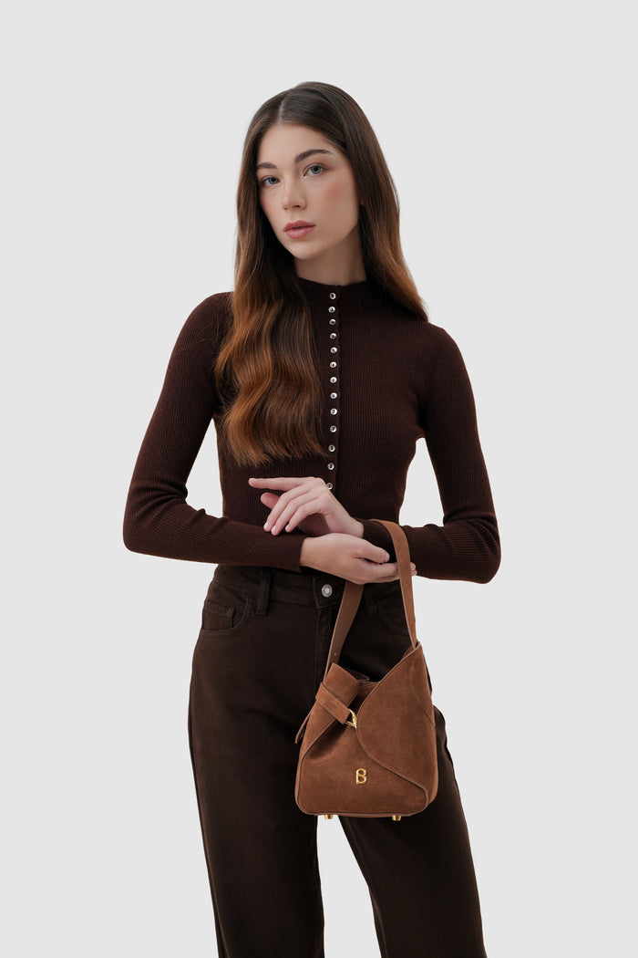 britney bag with suede leather in caramel by buttonscarves carried on wrist
