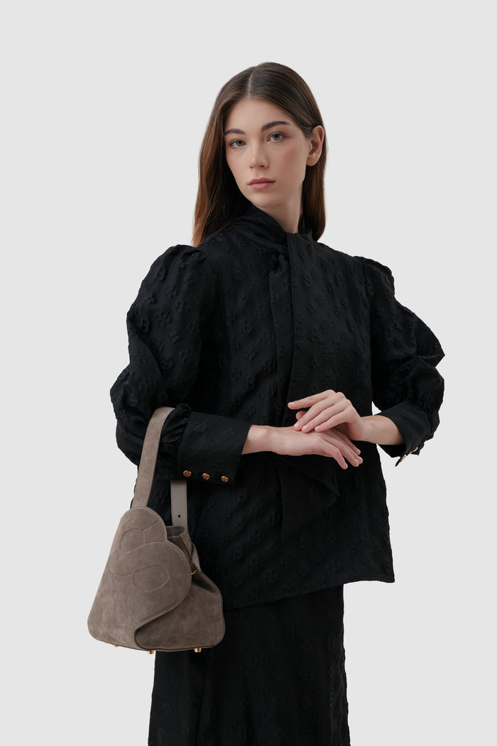 britney bag with suede leather in taupe by buttonscarves carried on wrist