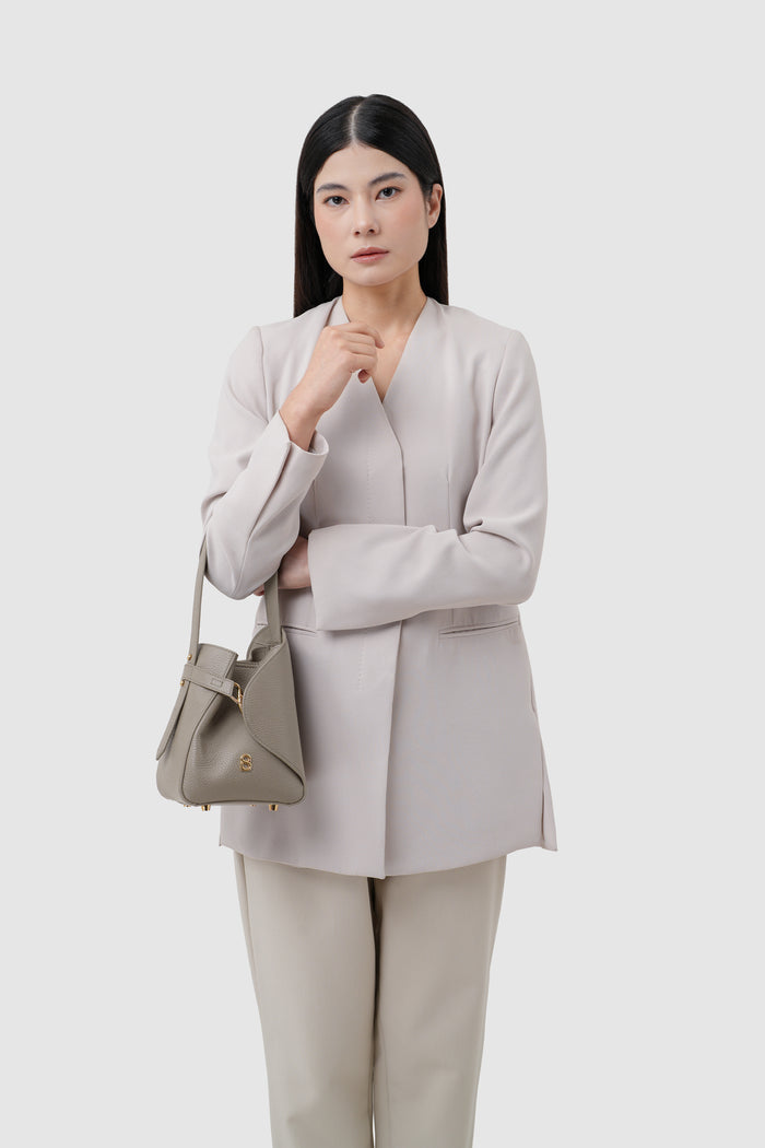 britney bag small in taupe with ghw by buttonscarves carried on wrist