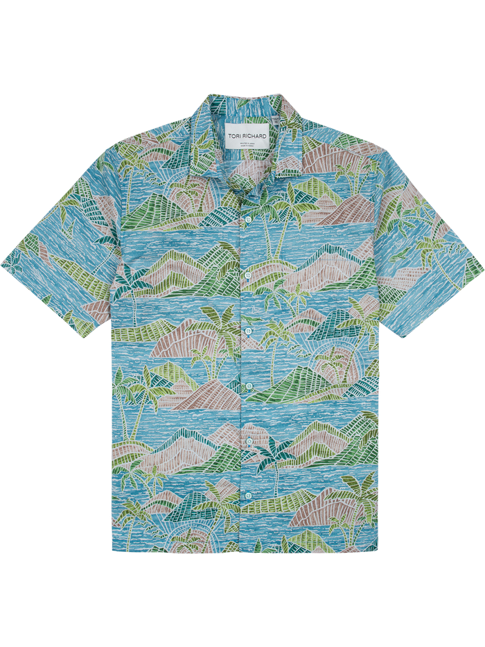 Multicolored shirt with blue, pink, and green tropical print in lightweight cotton lawn fabric .