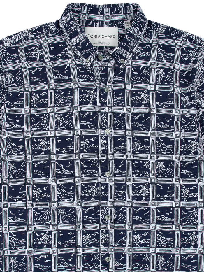 Navy short-sleeve shirt with white grid and tropical print, shown from front and fabric detail views.