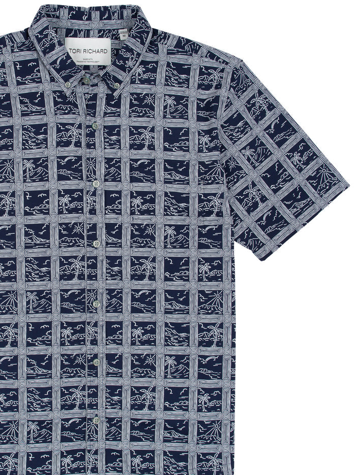 Navy short-sleeve shirt, white geometric/botanical print, front view.