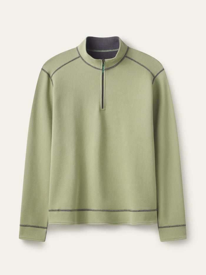 Light green stretch-cotton quarter-zip top with reversible light grey inside, flat lay, front view with contrast seam stitching.
