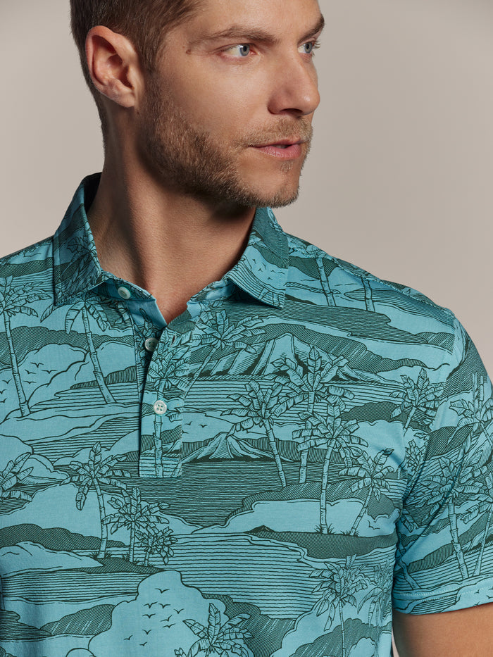 Blue tropical-print polo shirt, front view, features UPF sun protection.