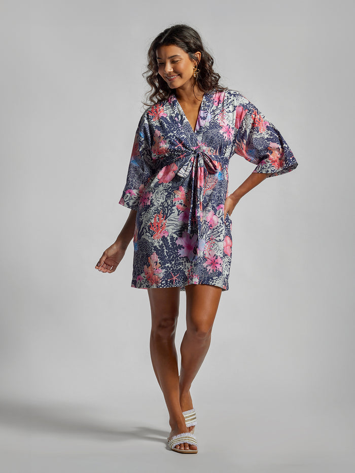 Coral floral-print kimono-style dress with pockets, front view.