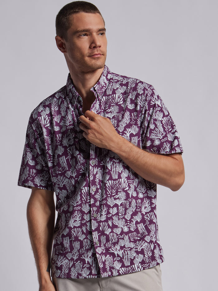 {{Purple Tradewind Technology® shirt, solid color, man shown from side with hand at collar}}{{/AltText}}.