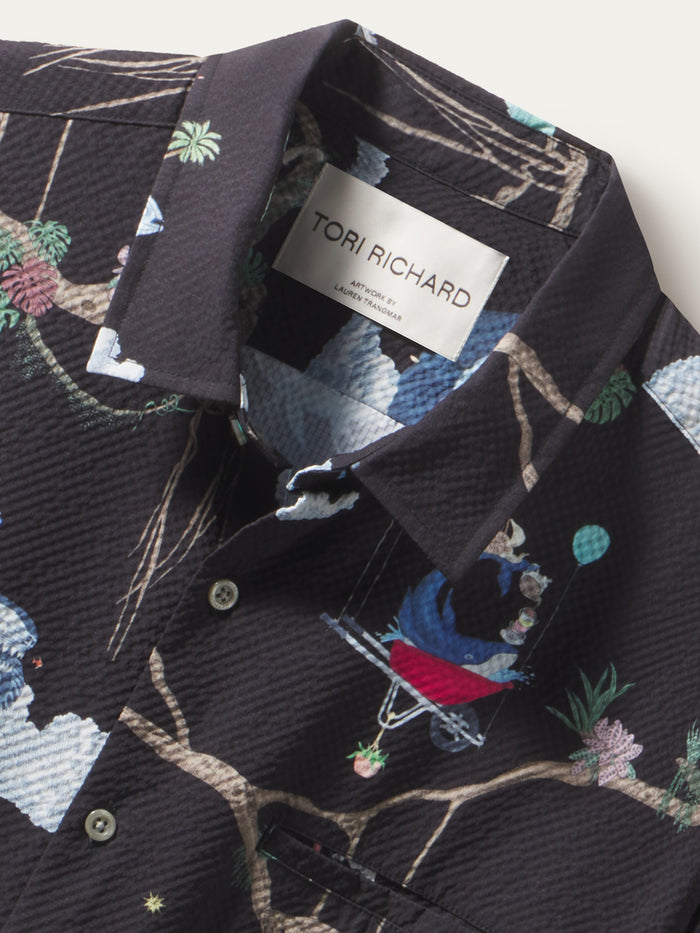 Black shirt, cloud and monkey print, short sleeves, cooling polyester, with UPF sun protection, front view.