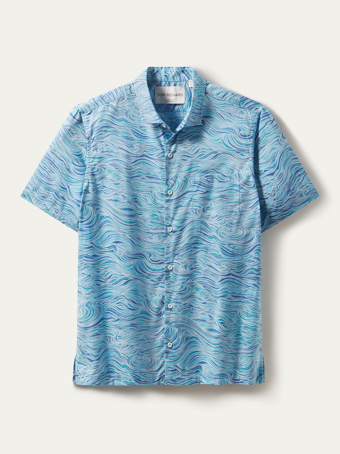 White and blue wave-print short-sleeve button-up shirt, flat lay front view.