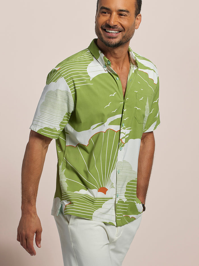 Green and white colorblock short-sleeve shirt, front view, with white pants.
