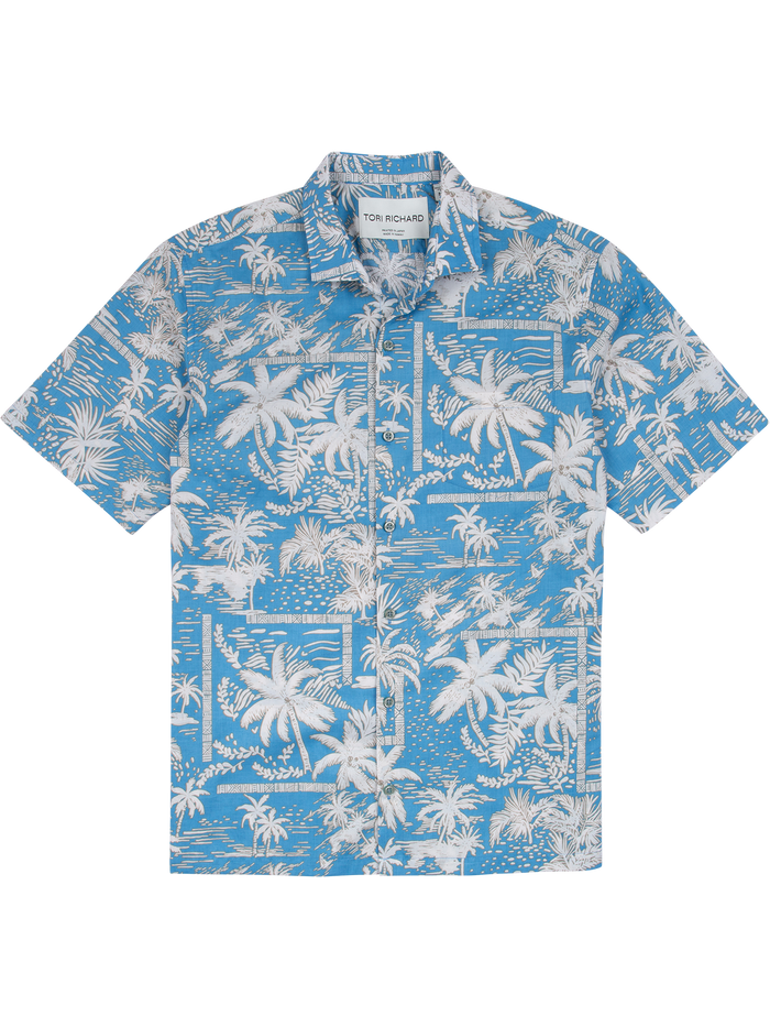 Blue Hawaiian shirt with white palm print, short sleeves, front pocket, flat lay front view.