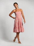 Red solid convertible maxi skirt, front view with sandals, on neutral background.
