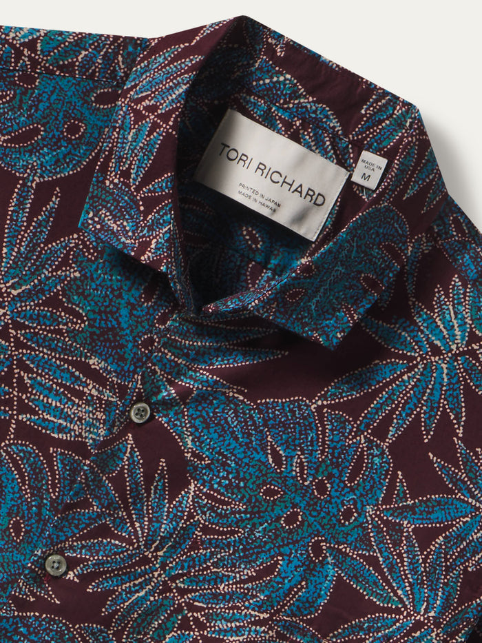 Maroon and blue floral-print cotton shirt, close-up of collar detail with label.
