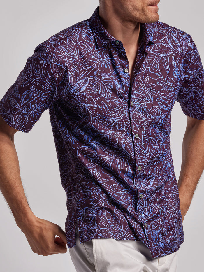 Purple batik-print short-sleeve shirt, front view.