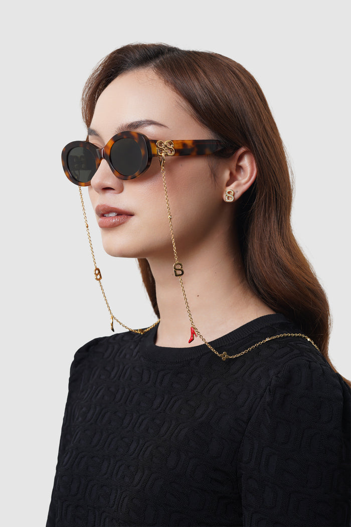 elia sunglasses in havana brown by buttonscarves worn with eyewear chain look