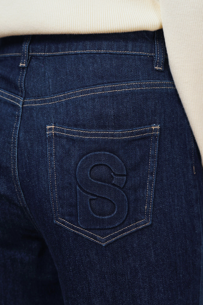 emma baggy denim pants in navy by buttonscarves signature b detail