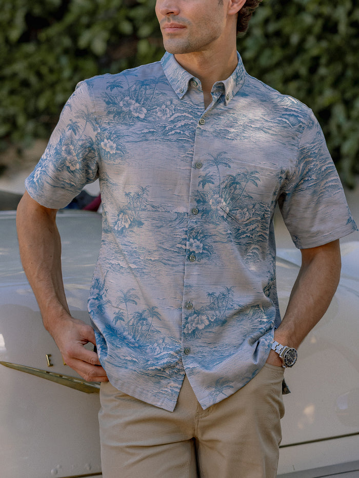 Cream etched scenic jacquard short-sleeve shirt with khaki pants, side outdoor view.