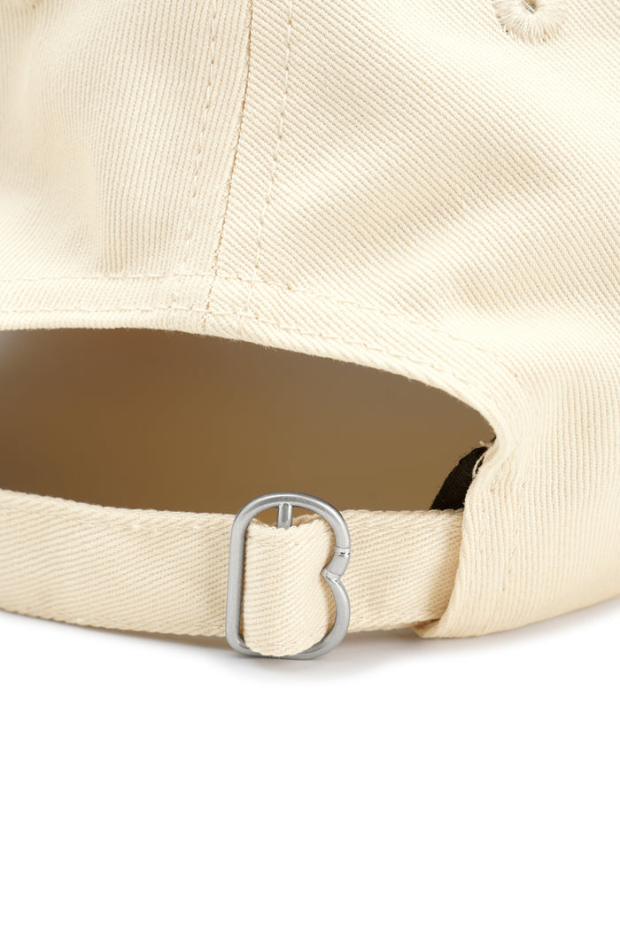 everyday cap in beige by buttonscarves adjustable strap detail