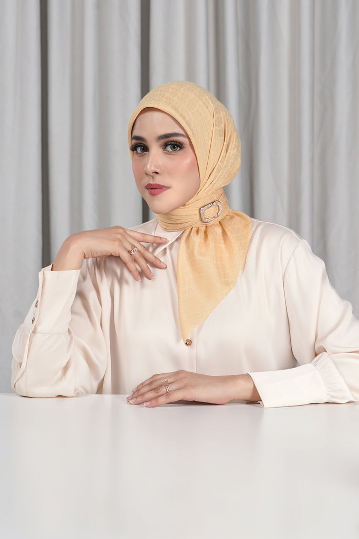 everyday tapis embossed 2.0 scarf in beige by buttonscarves front view