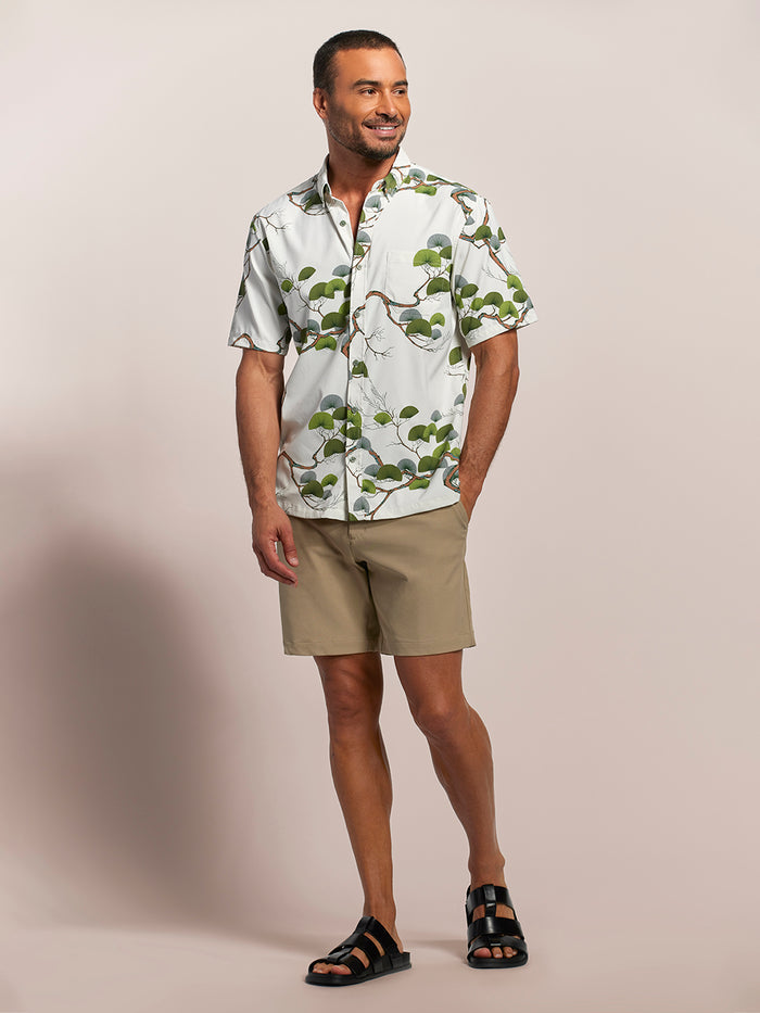 White Japanese pine-print short-sleeve shirt, Tradewind Technology® shirt, and tan shorts, front view.