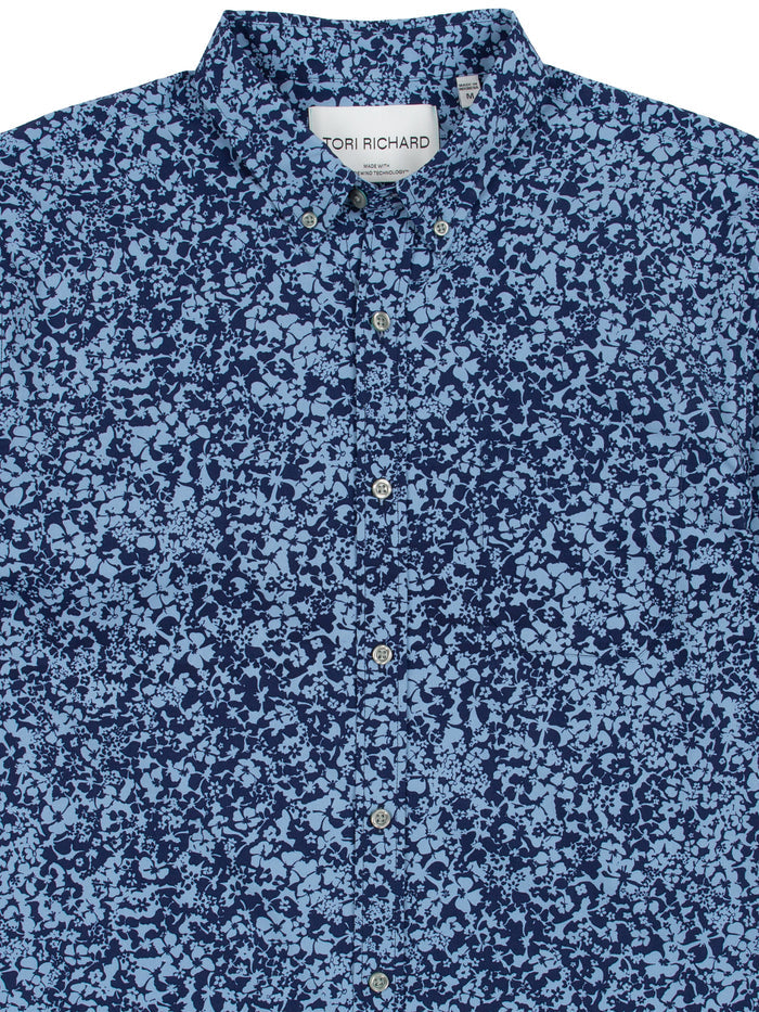Blue abstract floral-print button-up shirt with Tori Richard collar label, front view.