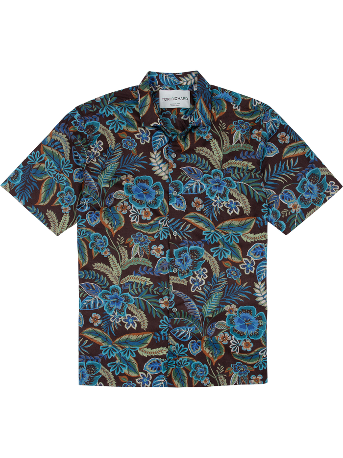 Cocoa short-sleeve shirt with blue and green tropical foliage print, flat lay front view.