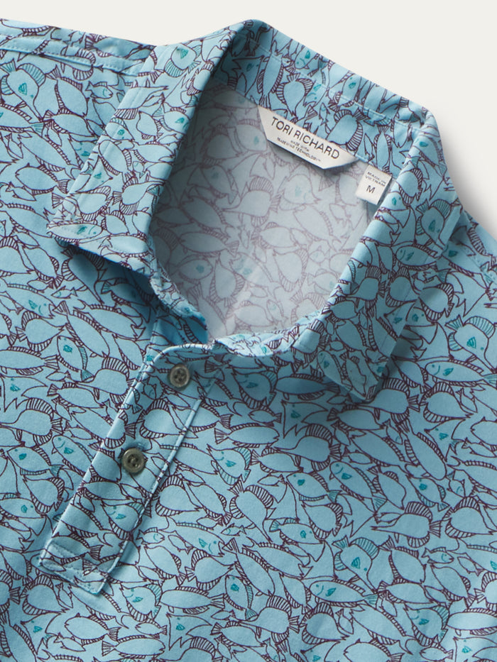 Blue island fish-print polo, partial button front, Tori Richard label, front view.